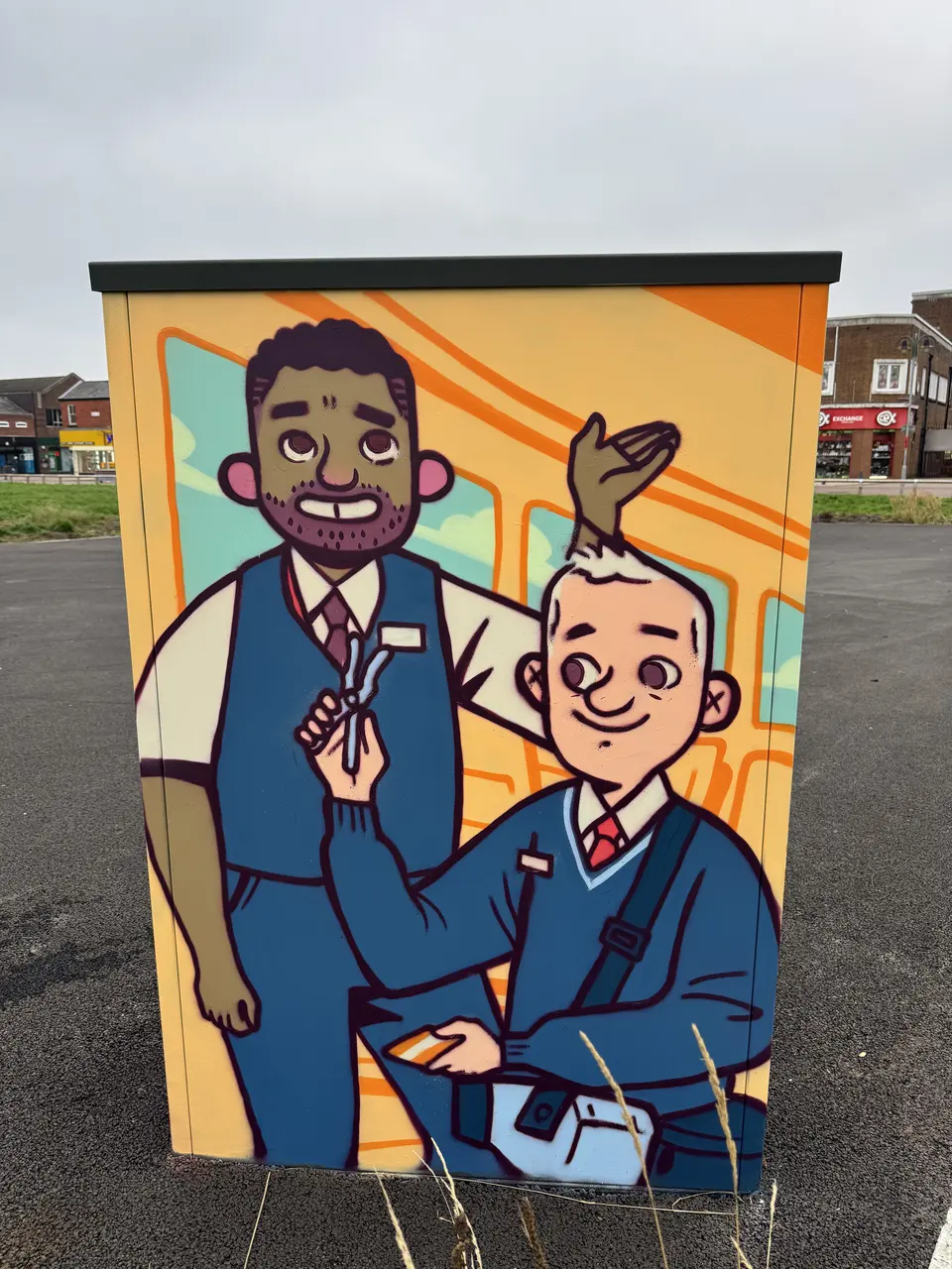 Painted utility cabinet: a smiling station worker in a waistcoat stands beside a grinning postal worker in blue, against bright orange tracks.